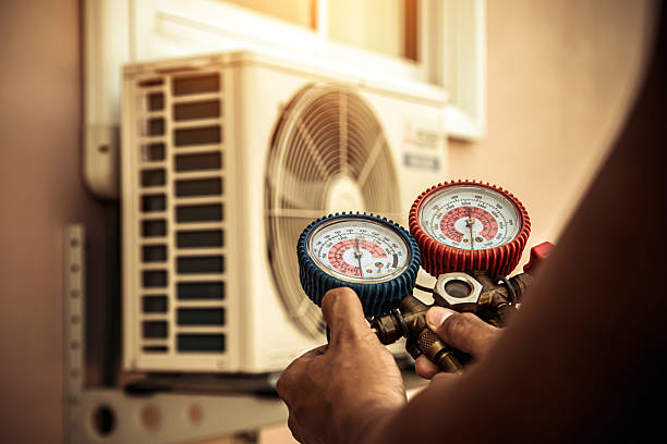 Professional Air Conditioning Service technician working in Wayland, MI
